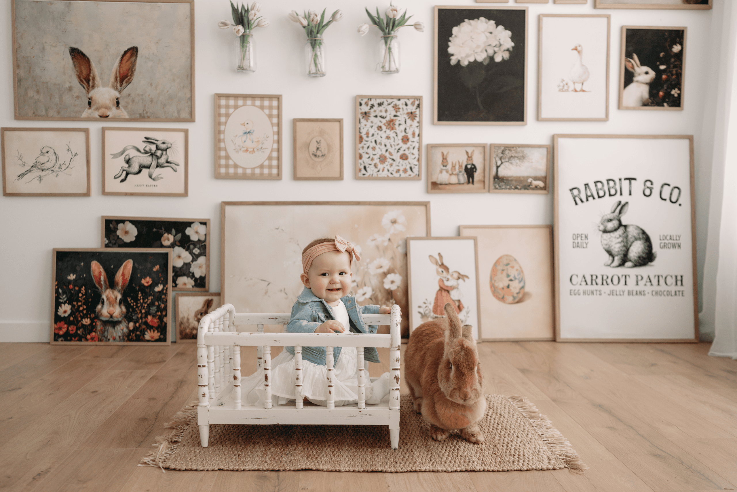 Child with bunny and rabbit-themed artwork in cozy studio setting.