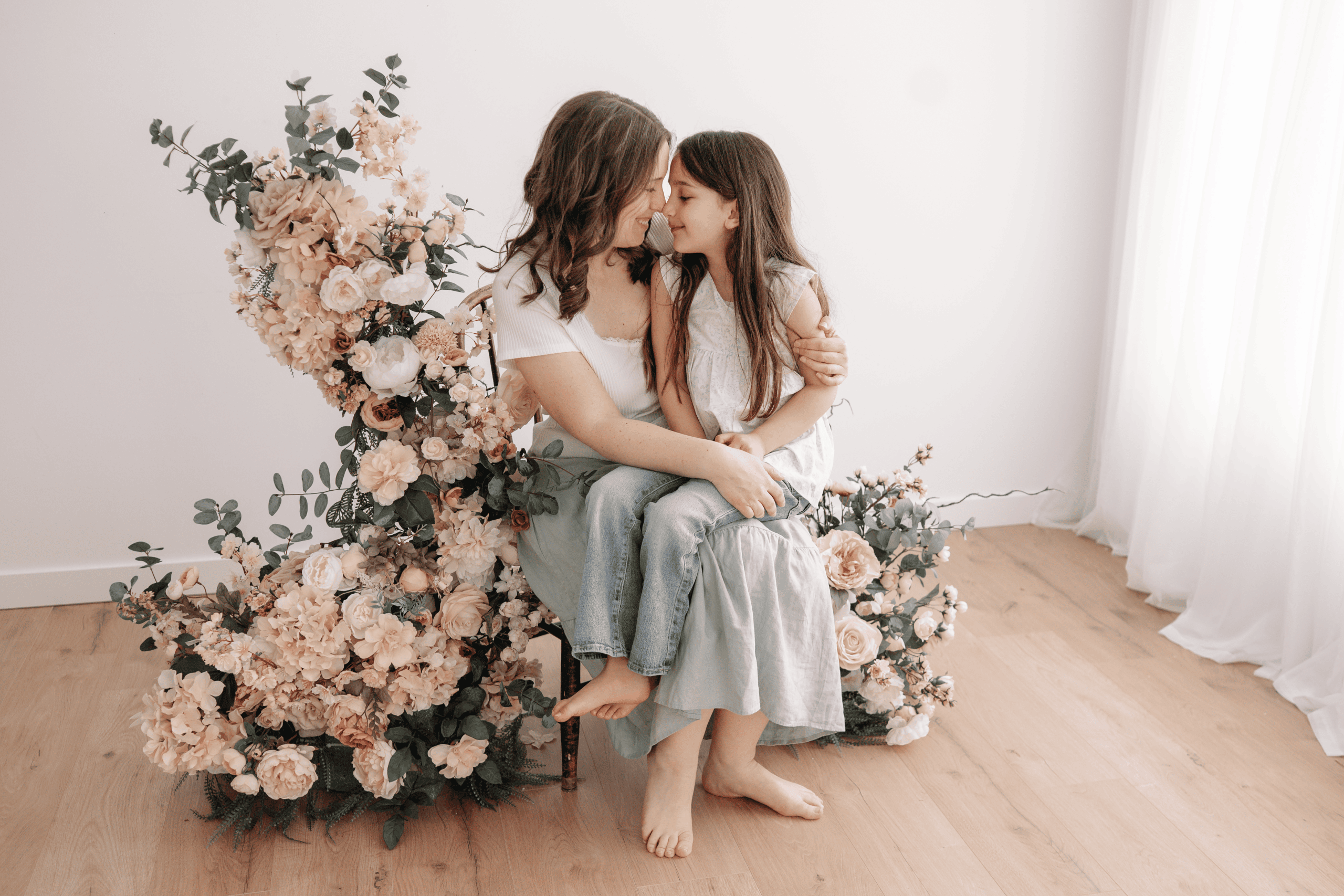 Motherhood Minis photo session in Prince George, BC, featuring a mother and daughter sharing a tende.